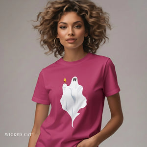 Person wearing a black t-shirt with a ghost holding a glass of champagne