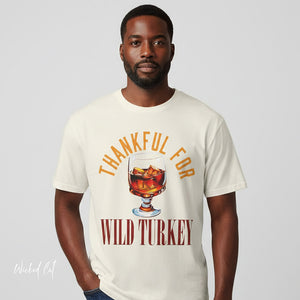 Person wearing a black t-shirt with 'Wild Turkey Funny Holiday' design on a plain background